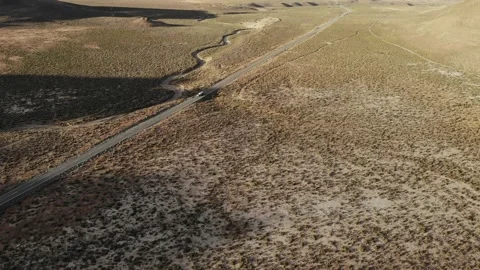 Truck Pulling RV Trailer through Nevada Desert - Aerial Drone Stock Footage 198458810