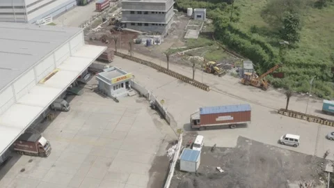 A truck pulls in to a delivery station, DHL Stock Footage 199193301
