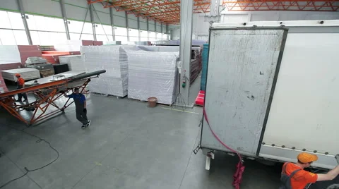 Truck pulls up to the loading belt in the hangar Stock Footage 56234476