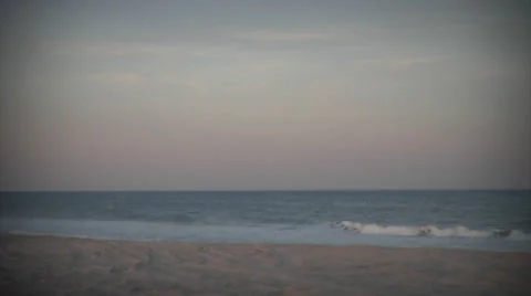 Truck pulls to stop near surf at dawn, static vignetted Video stock 24457529