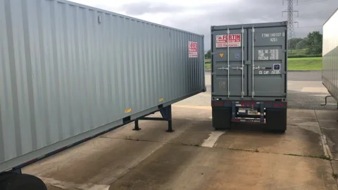 Truck with Shipping Container Backs in to Loading Dock 스톡 동영상 249345405