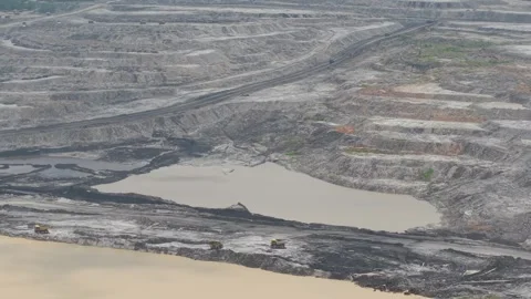 Truck traffic activity on coal mining hauling roads creates dust and pollut.. Stock Footage 333022585