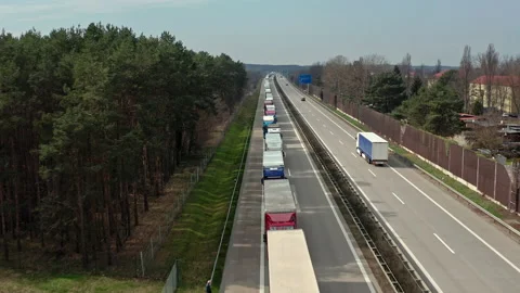 Truck in a traffic jam on a German motorway. The trucks are on their way to Pola 스톡 동영상 163111453