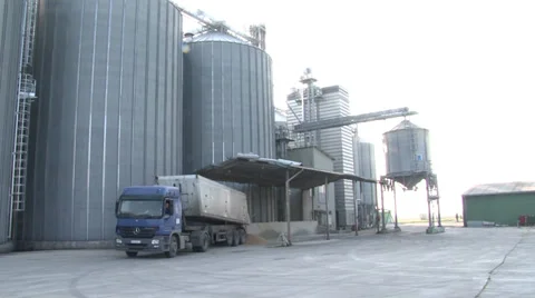 Truck unloading in silver silos Видео 36790147
