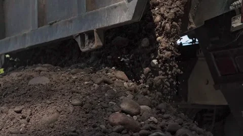 Truck unloads road construction materials Stock Footage 274530247