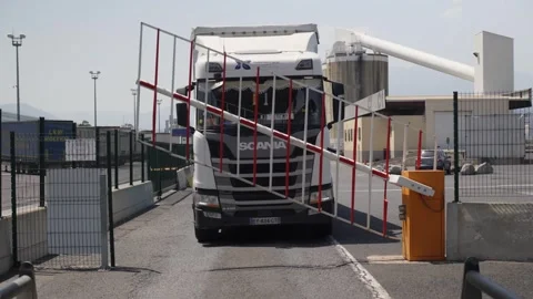 Truck Waiting as Security Barrier Gate Opens at Industrial Facility Entrance Stock Footage 337551837