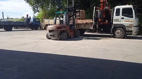 Truck With White Crane Loading A Pile Of Cement With Forklift. Stock Footage 309306861