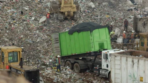 Truck Working In a Garbage Dump Stock Footage 65158226