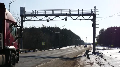 Trucking on road going under Multi lane free flow traffic control frame Видео 61416680