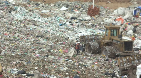 Trucks and Dozers Working in a Garbage Dump ( recycling ) Stock Footage 65158163