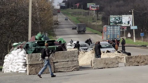 Trucks are driving through the checkpoint controlled by Ukrainian forces 스톡 동영상 231932297