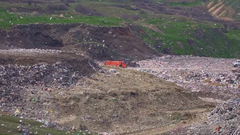 The trucks are dumping garbage. Environmental pollution. Stock Footage 105635842