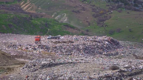 Trucks are dumping garbage. Environmental pollution. Stock Footage 105636356