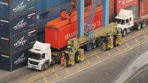 Trucks being loaded with cargo containers at the port of Valparaiso, Chile. Stock Footage 48896987