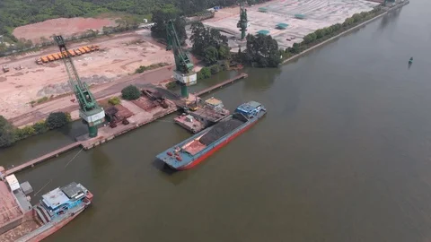 Trucks carry out loading build materials on the ship. Stock Footage 118031079