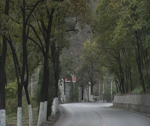 Trucks carrying coal move through town Video stock 86744791