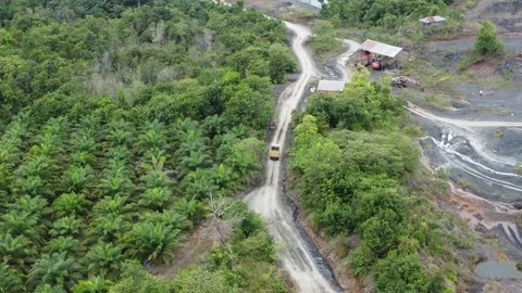 Trucks carrying a load of rocks on uneven roads Stock Footage 313580564