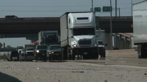Trucks drive by low shot Stock Footage 37243669