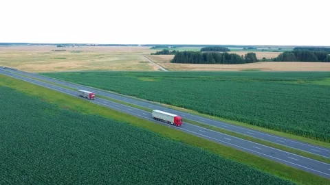 Trucks Driver With Trailer Carrying Cargo On Speed Intercity Highway Aerial View Stock Footage 220298750