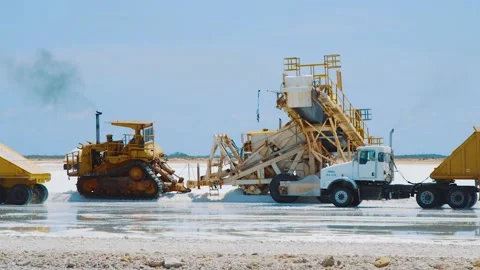 Trucks Driving Over The Salt Flat In Kralendijk, Bonaire For Salt Loading Stock Footage 132194360