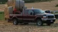 Trucks Hauling Hay Bales HD Footage