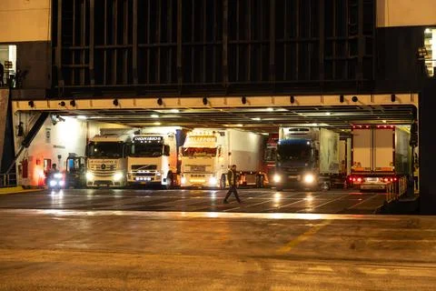 Trucks lined up on car ferry loading deck 库存照片