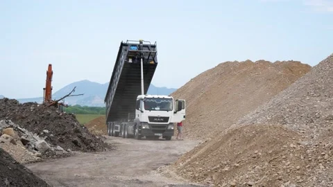 Trucks MAN. construction site, dump crushed stone. Russia, Stavropol, 10.06.20 Stock Footage 144244021