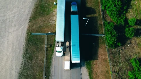 Trucks at manufacturing facility Stock Footage 307964036