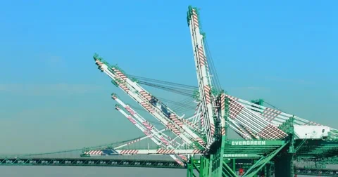 Trucks move cargo containers on the bridge at sea port in Los Angeles, 4K, RAW Stock Footage 68538342