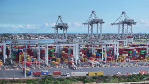 Trucks moving around the container area of Webb Dock in Port Melbourne Stock Footage 277967937