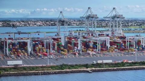 Trucks moving into position to load containers at Webb Dock in Port Melbourne Stock Footage 277967864