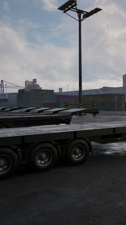 Trucks parked in a loading area near a shipping dock on a cloudy day Stock Footage 339107125