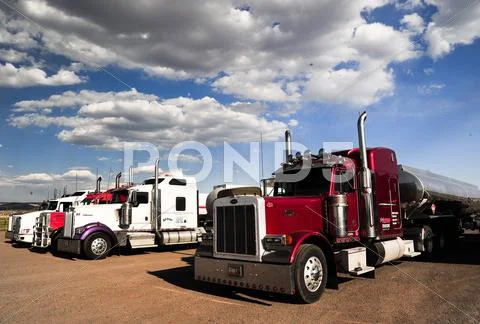 Trucks in a parking lot Stock Photos