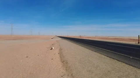 Trucks Passing - Road 75 Egypt Desert. NOV 16 2022 Video stock 307057016