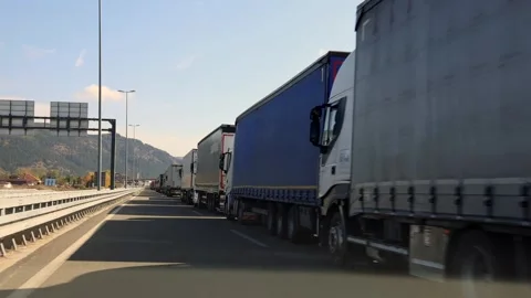 Trucks Queue Border Drive Stock Footage 300791721