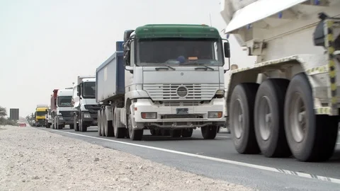Trucks queued up during construction boom in Qatar Stock Footage 105801720