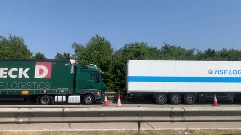 Trucks queuing up to leave UK Stock Footage 201525720