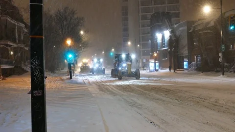 Trucks removing snow at night Stock Footage 125555218