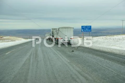 Trucks Stop To Remove Chains
