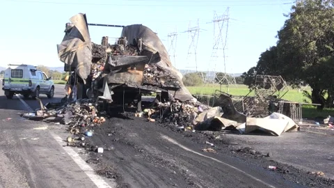 Trucks torched on National road in Cape Town Stock Footage