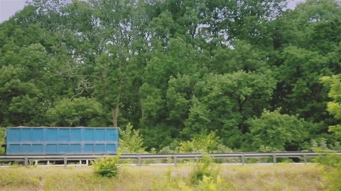 Trucks with trailers are driving on the highway Stock Footage 77749935