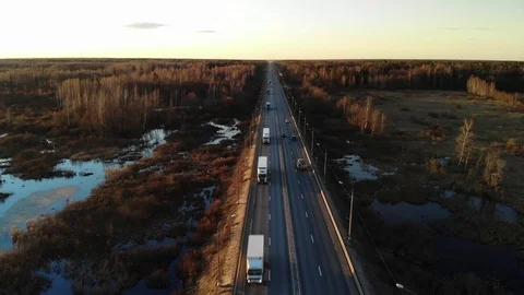 Trucks with trailers drive on the road. Video stock 106328729