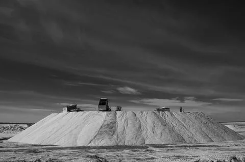 Trucks unloading raw salt bulk, Salinas Grandes de Hidalgo, La Pampa, Argen.. Stock Photos