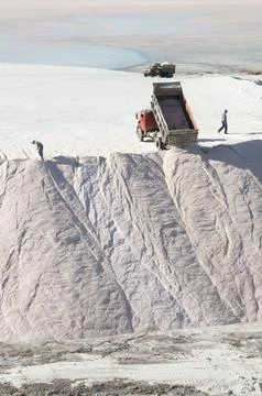 Trucks unloading raw salt bulk, Salinas Grandes de Hidalgo, La Pampa, Argen.. Stock Photos