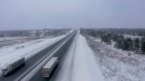 Trucks on a winter track drone video Stock Footage 170221353