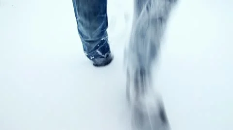 Trudging through snow Stock Footage 21765010