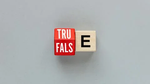 TRUE and FALSE concept. One letter on wooden blocks changes the word false  Stock Photos