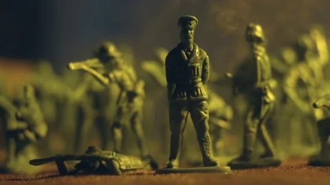 True battle fire on plastic toy soldiers set, battle flamethrower with smoke Stock Footage 238749773