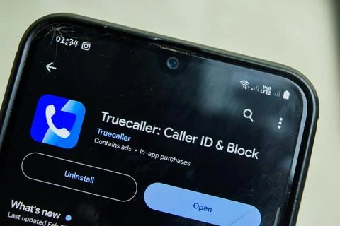 True Caller application on Smartphone screen. Caller ID and Block Stock Photos