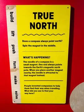 True North interactive compass exhibit sign about magnetic navigation at a .. Stock-Fotos